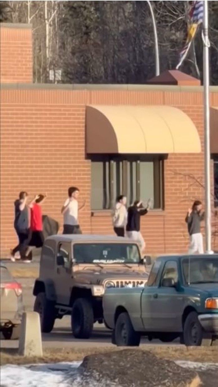  A total of 10 people are dead after a pair of shootings Tuesday in the tiny community of Tumbler Ridge in B.C.’s Peace region. The community went into a lockdown that lasted several hours, after police were called about an active shooter at Tumbler Ridge Secondary School. In this still from a video provided to the Associated Press from the scene, students are seen being escorted out of the school with their hands in the air. THE CANADIAN PRESS/AP-Jordon Kosik