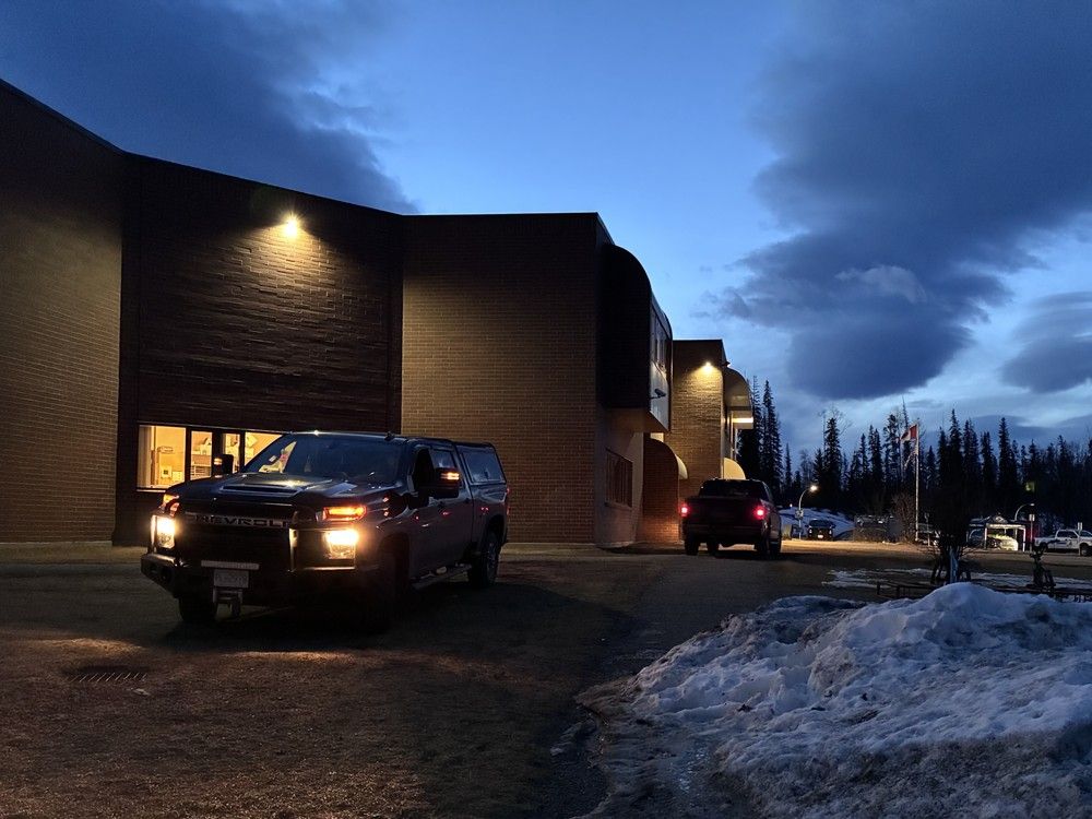  RCMP hold a perimeter around Tumbler Ridge secondary school on Feb. 11, 2026, the morning after the mass shooting