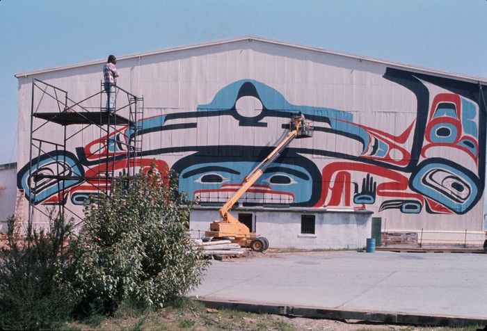  The mural for Habitat Forum that was designed by Bill Reid, while it was being painted onto the south side of Hangar 3 at Jericho Beach, 1976. Erol H. Baykal/City of Vancouver Archives AM1671-: 2011-130.0489
