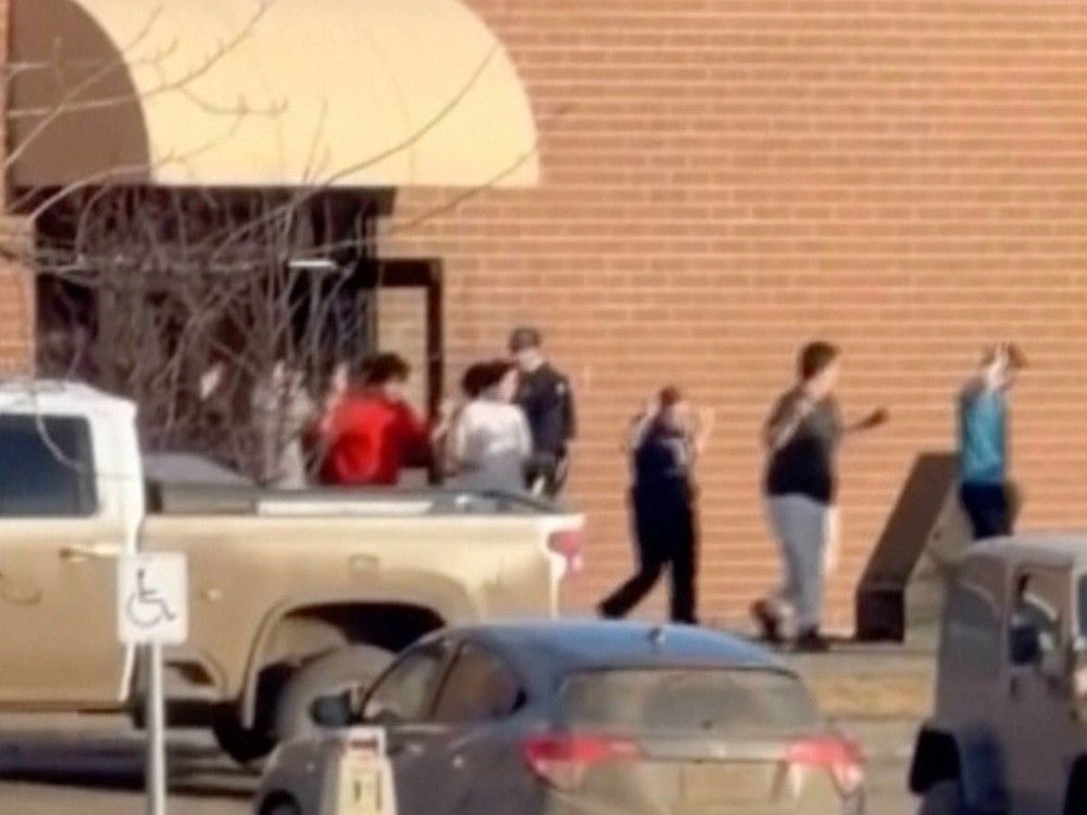  This grab from video shows students exiting the Tumbler Ridge school after the deadly shootings
