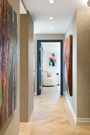 Artwork throughout the home was carefully layered to create the sense of a collection built over time. Pieces include works sourced through Leftbank Art and licensed selections from Vancouver's Art Works Gallery, including artists Gillian Lindsay, Sheila June Magee and Hakan Burcuoglu.