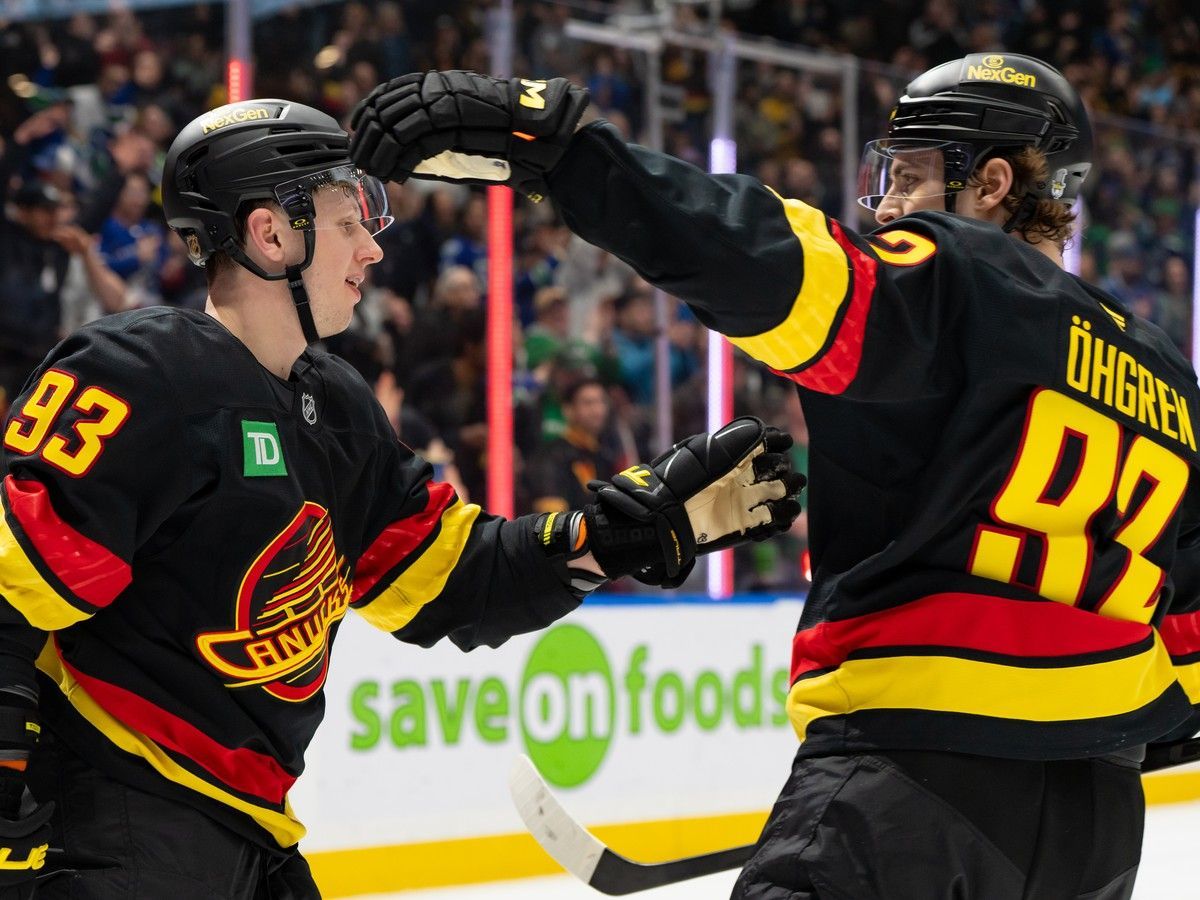 Marco Rossi (left) is congratulated by Liam Ohgren after scoring a goal against the Florida Panthers earlier this month