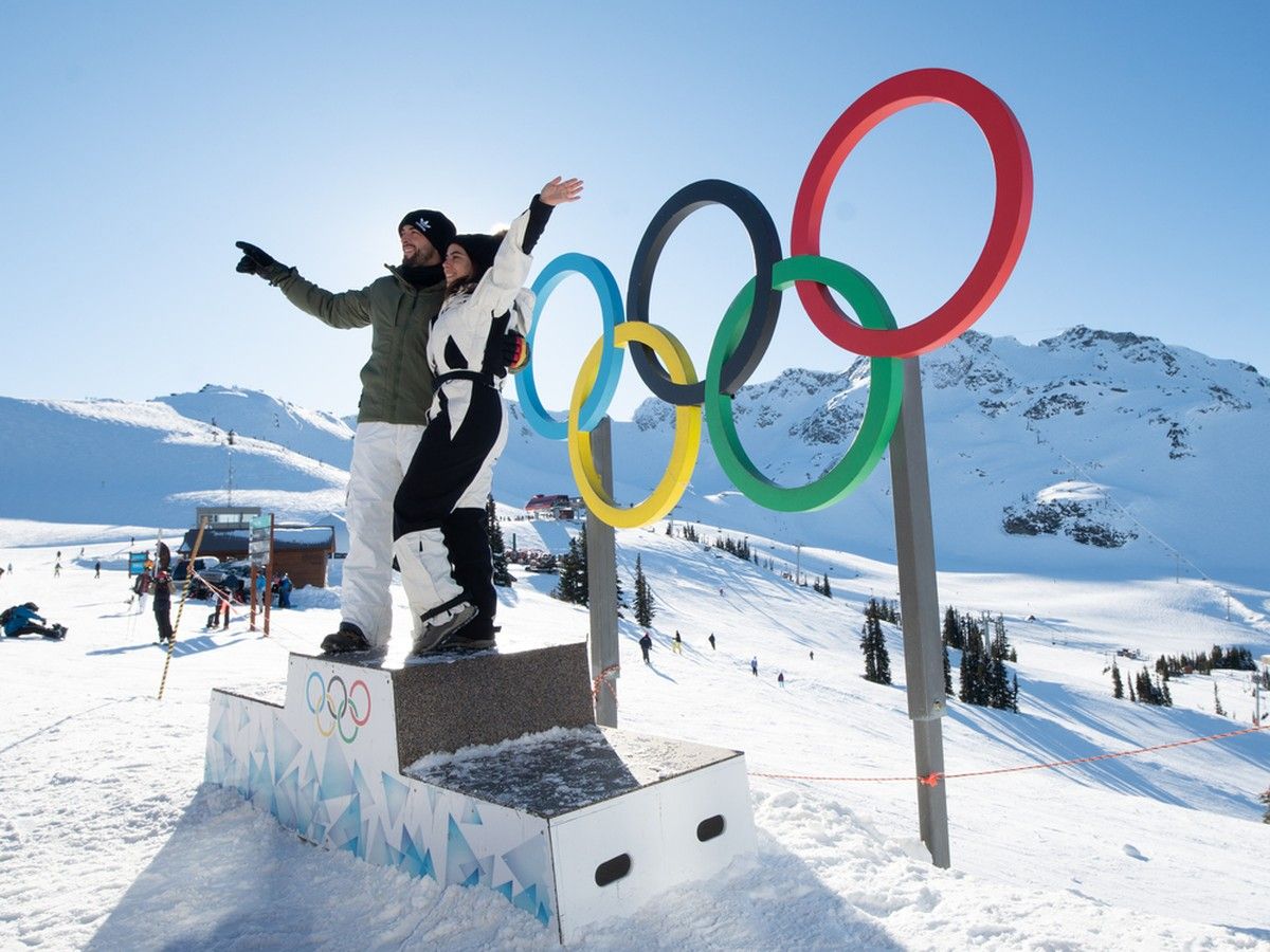  Guests pose with the Olympic rings on Whistler Mountain, celebrating the resort’s enduring legacy from the 2010 Winter Games.