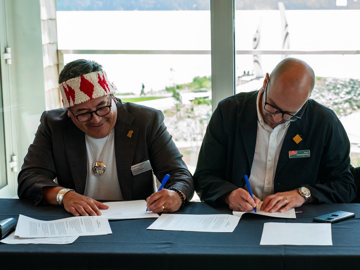 Squamish Nation councillor and spokesperson Sxwíxwtn Wilson Williams and Squamish Mayor Armand Hurford at signing on July 22, 2025 that led to creation of 