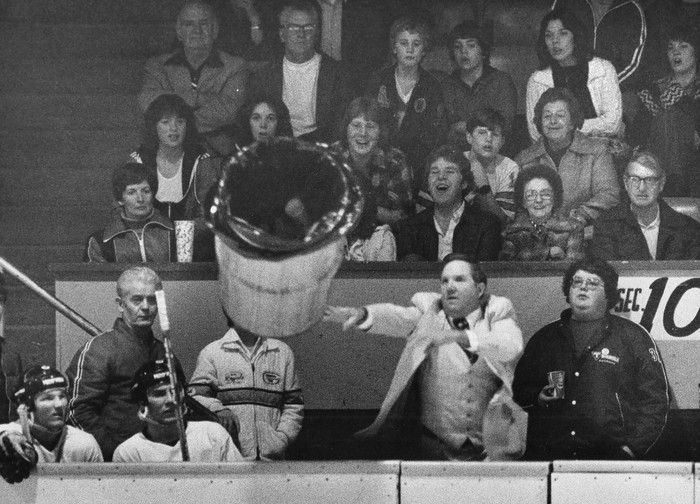  New Westminster Bruins coach Ernie (Punch) McLean throws a garbage can onto the ice at Queen’s Park Arena in New West on March 2, 1980. Craig Hodge photo.