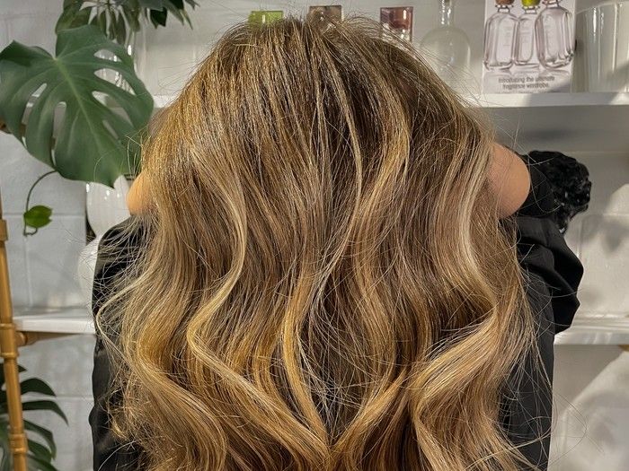 Blonde hair with highlights.
