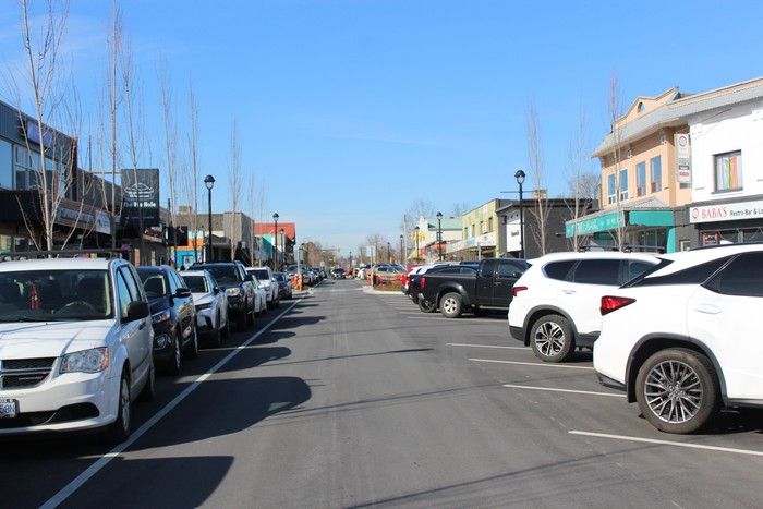 Parked cars line the one-way stretch of the Fraser Highway in Langley City.