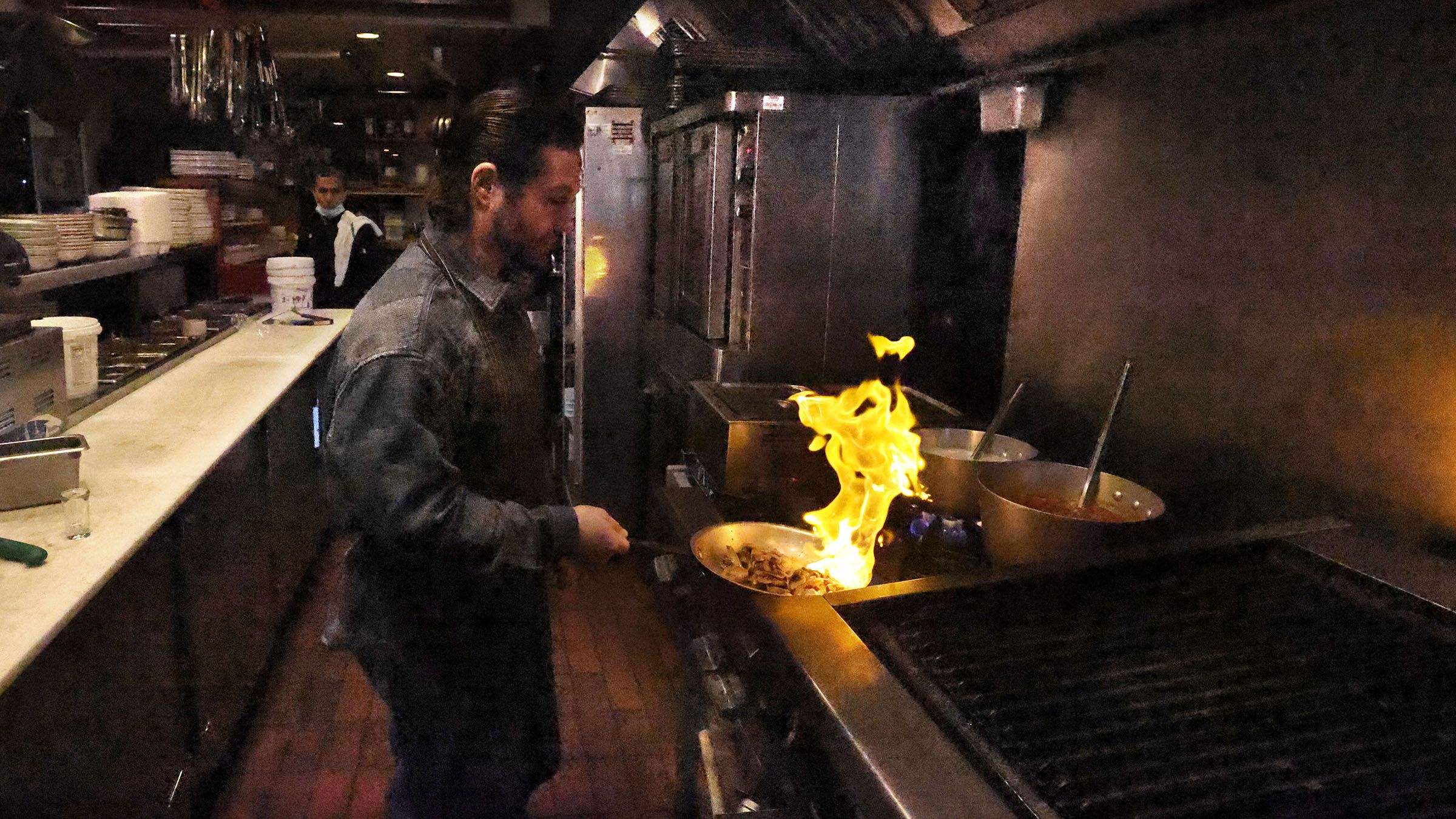 Iani Makris works with the flame in the kitchen of Anatoli Souvlaki in North Vancouver. He and his brother co-own the restaurant on Lower Lonsdale.