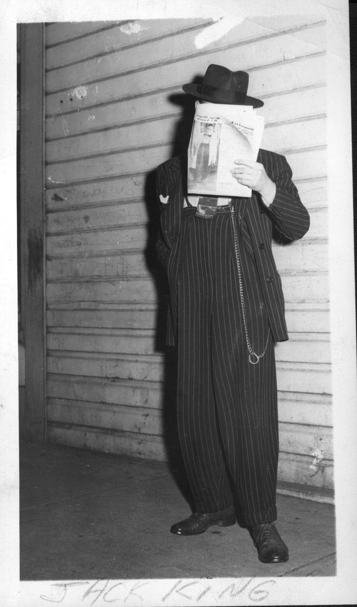  Vancouver Sun photo of a zoot suiter identified as Jack King. He’s holding a June 19, 1943 paper over his face, which contained a front-page story and photo of the Zoot Suit Riots in Los Angeles