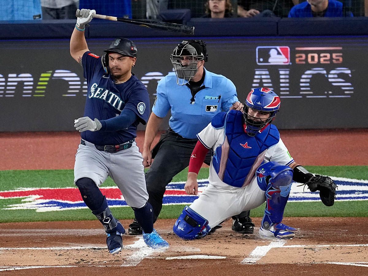 Canadian Josh Naylor of the Seattle Mariners gets a hit against the Toronto Blue Jays' Shane Bieber during their ALCS matchup in October 2025. Vancouver Mayor Ken Sim is proposing a bid for a Major League Baseball franchise in Vancouver.