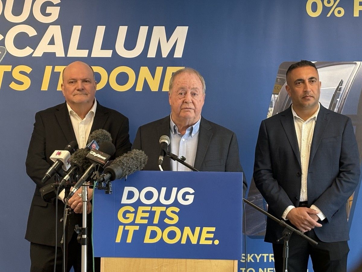 Doug McCallum (C) announces his run for mayor on April 13, 2026. He is flanked by current city councillors Doug Elford (L) and Mandeep Nagra (R). 