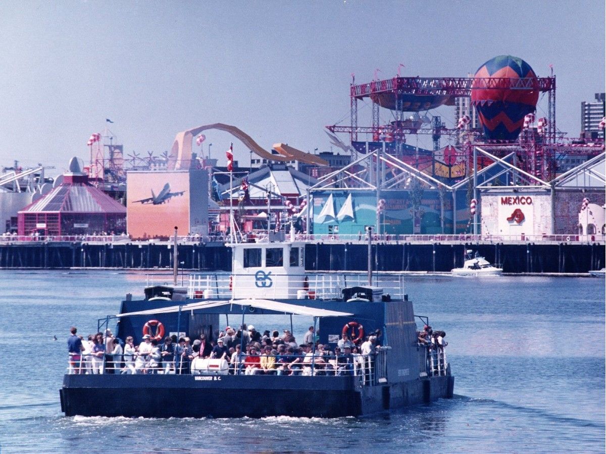 Passengers ride across the water toward the Expo 86 fairgrounds in Vancouver, BC.