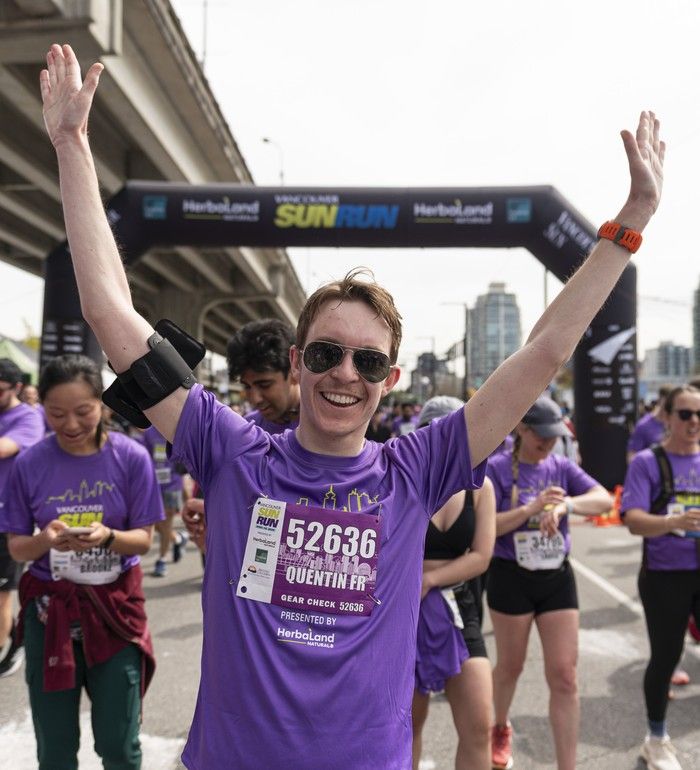 Finishers celebrate after crossing the finish line at the 2026 Vancouver Sun Run in Vancouver on April, 19, 2026.