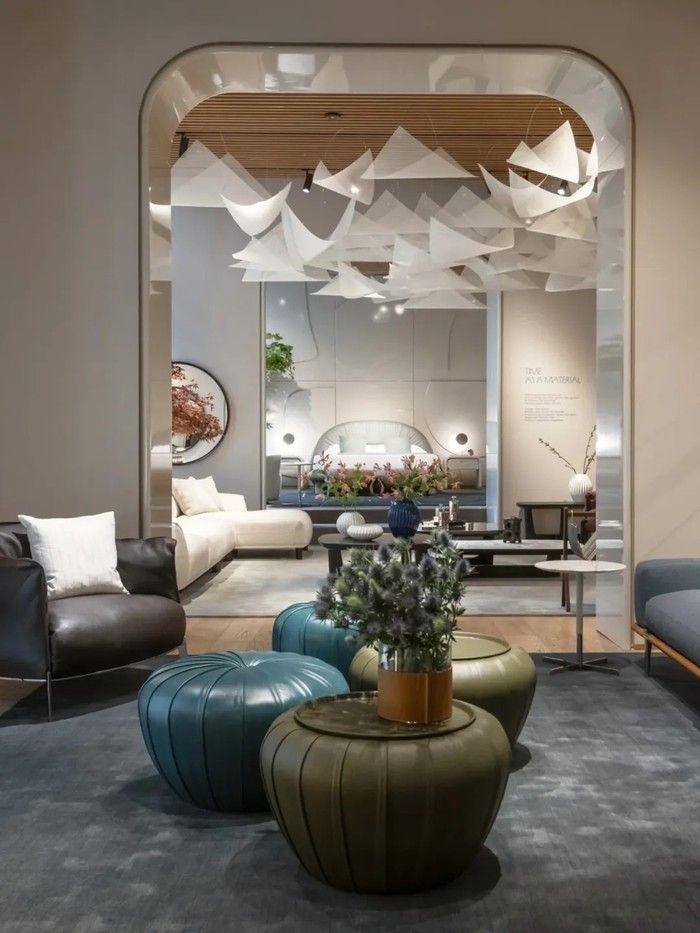 Poltrona Frau at Milan Design Week 2026. Soft sculptural seating and curved silhouettes reflect a move toward warmer, more relaxed living spaces