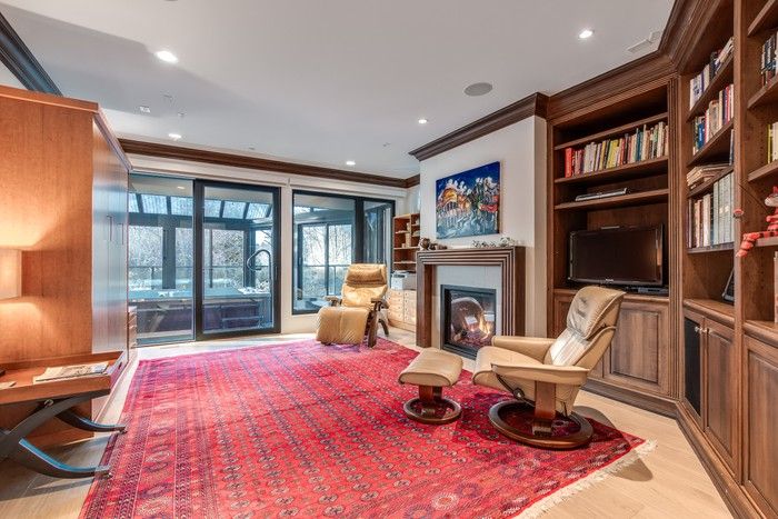  Cosy den with gas fireplace.