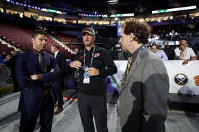 Tom Dundon (centre) of the Carolina Hurricanes attends the 2019 NHL Draft at Rogers Arena in Vancouver.