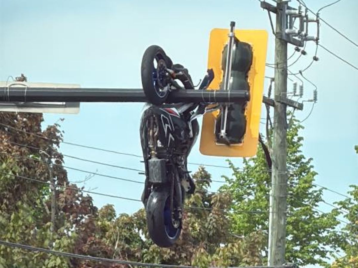 Delta crash sends motorcyclist to hospital, leaves bike suspended in traffic lights