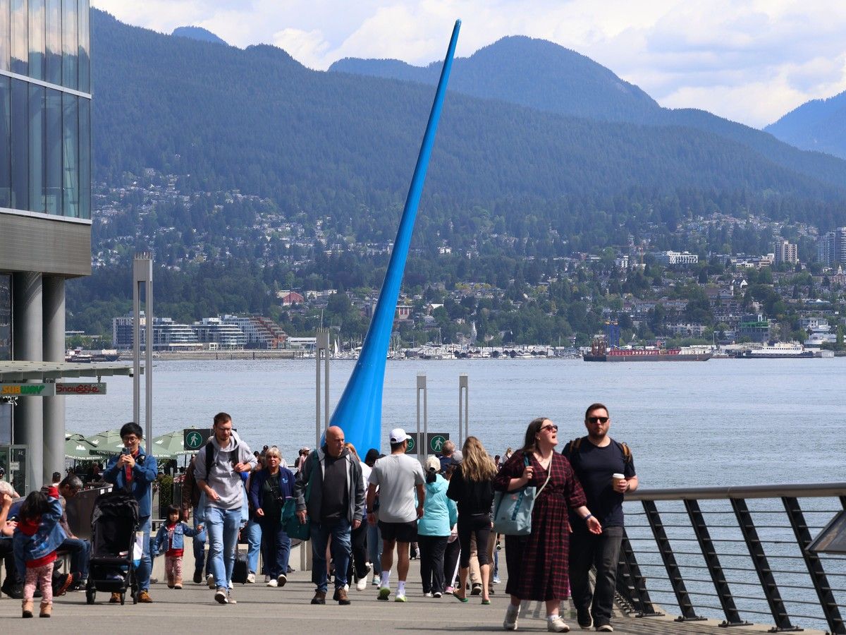  People gather on the north side of the Vancouver Convention Centre on May 18, 2026