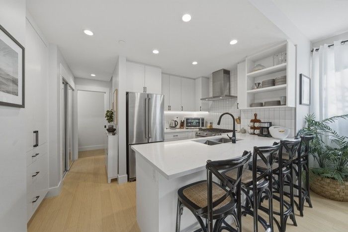 High-end appliances and hardwood floors in the kitchen.