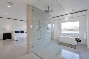 Primary bedroom features stylish bathroom.
