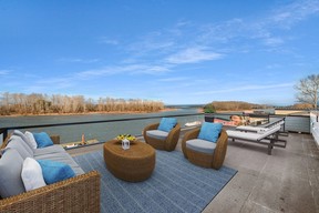 A spacious rooftop deck offers river views.