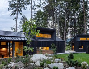 Dormer windows bring in southern light, while a charcoal siding helps blend the natural texture of cedar siding harvested and milled onsite.