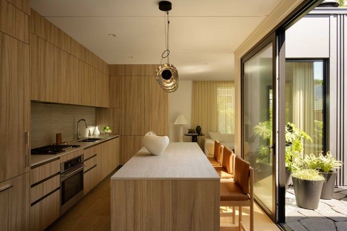 The streamlined kitchen opens directly onto the central courtyard.