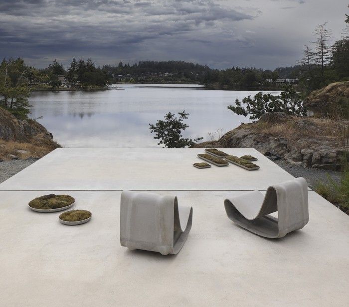 concrete terrace opens to a dramatic West Coast water view.