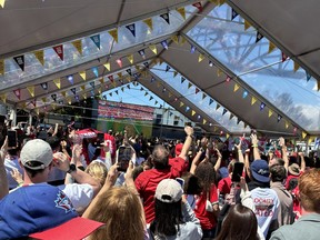 Jubilant fans at the Granville Island Watch Party in Vancouver celebrate after Canada defeats South Africa 1-0 in the World Cup round of 32 match on Sunday, June 28, 2026.