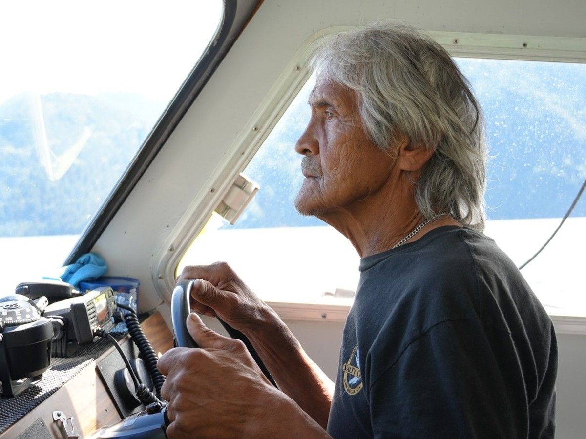 Tla'amin elder Gerry Gallegos scans the shoreline for wildlife.