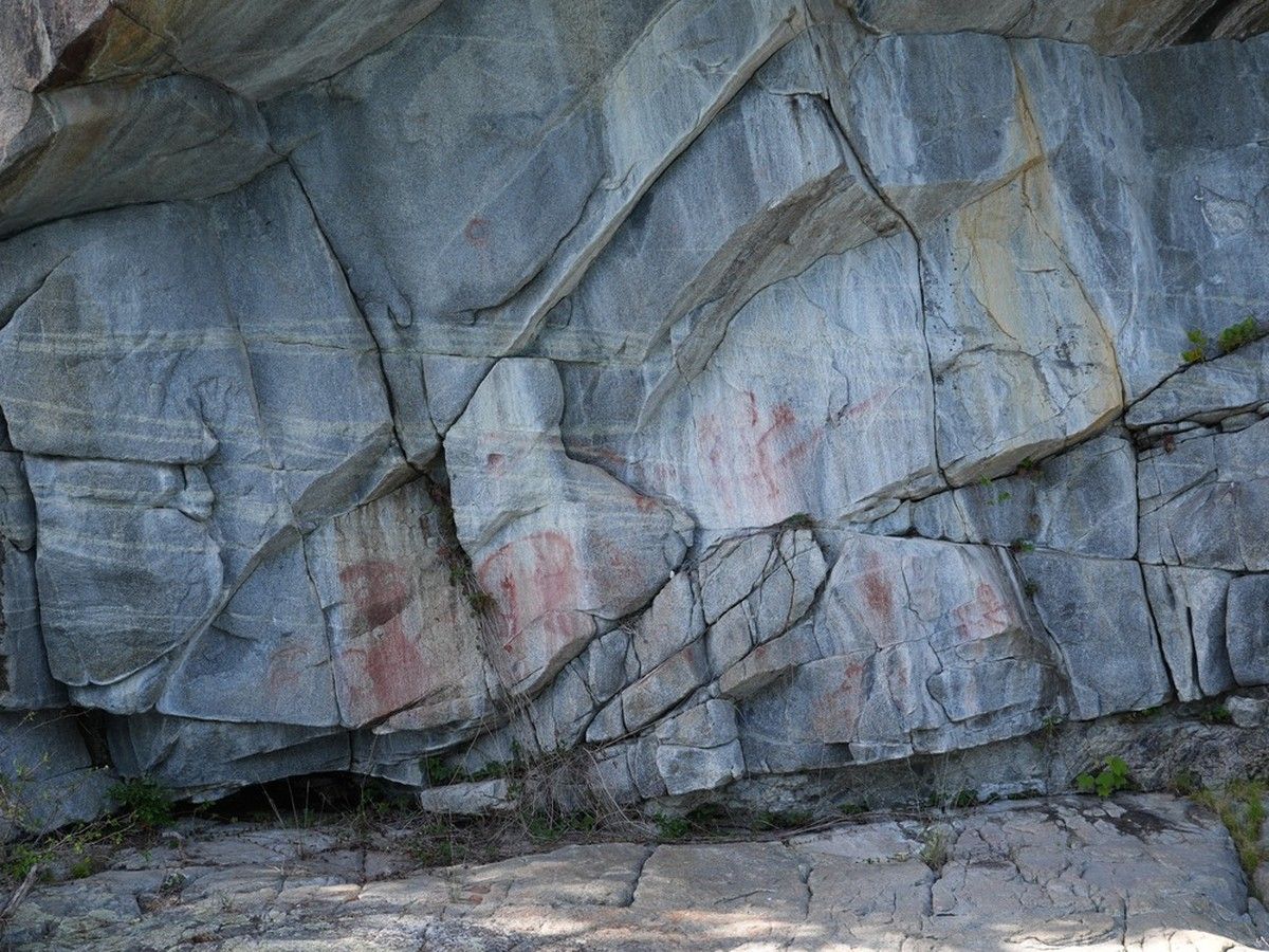 Ancient Indigenous pictographs painted to mark good fishing grounds or travellers' passage.