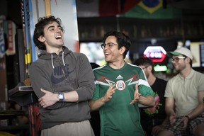 Soccer fans watch the opening match of the FIFA World Cup 2026 at The Cambie in Vancouver on June 11, 2026. Fans congregated in several areas Thursday to watch the opening match, including the FIFA Pedestrian Zone in downtown Vancouver.