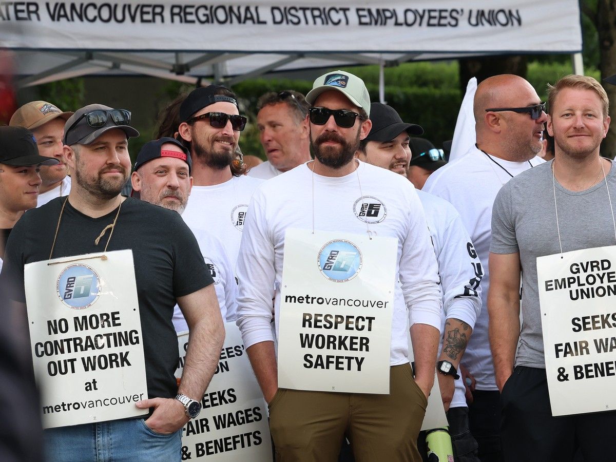 Metro Vancouver outside workers, members of the Greater Vancouver Regional District Employees' Union (GVRDEU) demonstrate on a picket line outside the utility's headquarters after walking off work in a full-scale strike, in Burnaby on June 15, 2026.