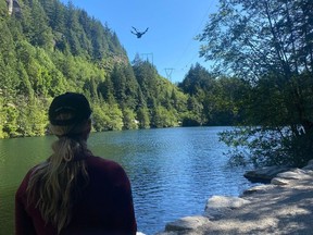 A Squamish Search and Rescue volunteer searching for missing boaters using a drone on May 30, 2026.
