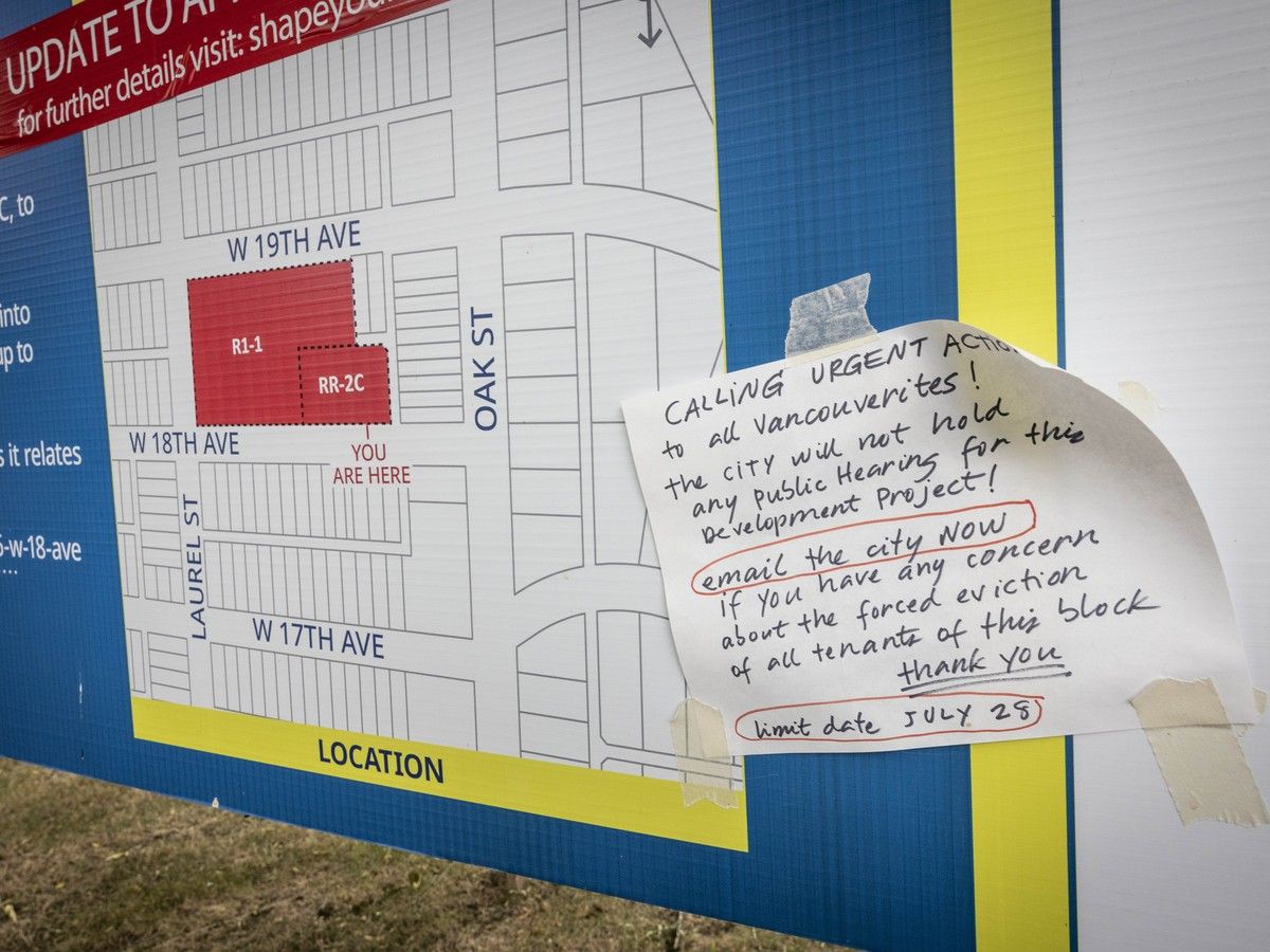  A paper taped to a sign showing the planned redevelopment urges people to email the city with their concerns.