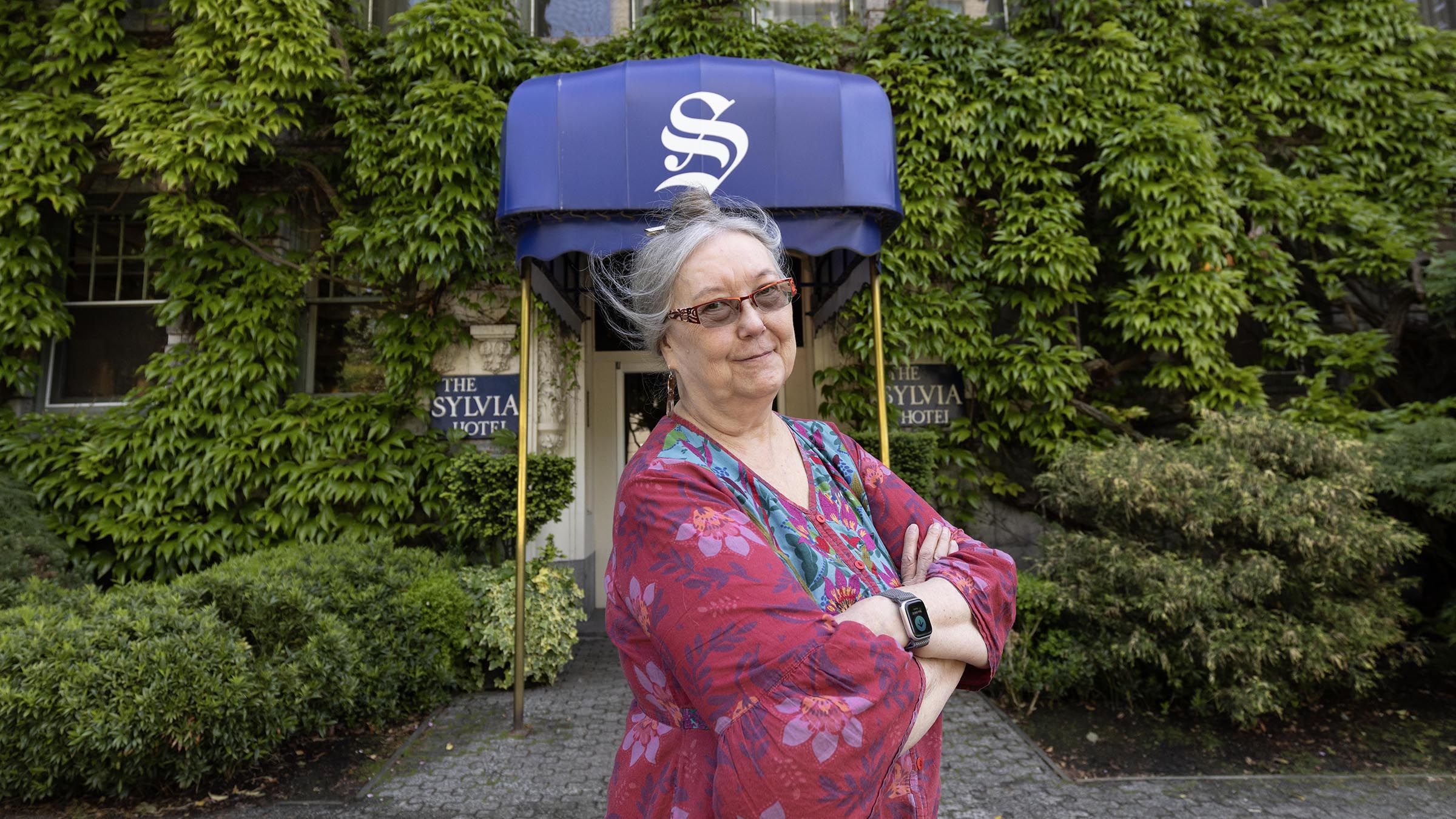 Michele Ley stands outside the Sylvia Hotel in Vancouver on May 27.