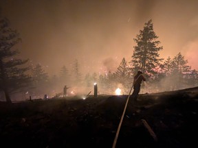 B.C. Wildfire Service do overnight suppression on the Bald Range fire near Summerland on Friday, Aug. 7, 2026.