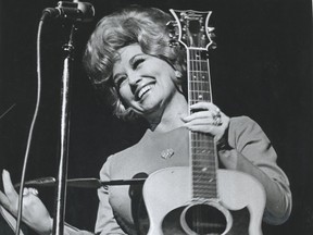 Dolly Parton performs as part of the Porter Wagoner show at the Queen Elizabeth Theatre.