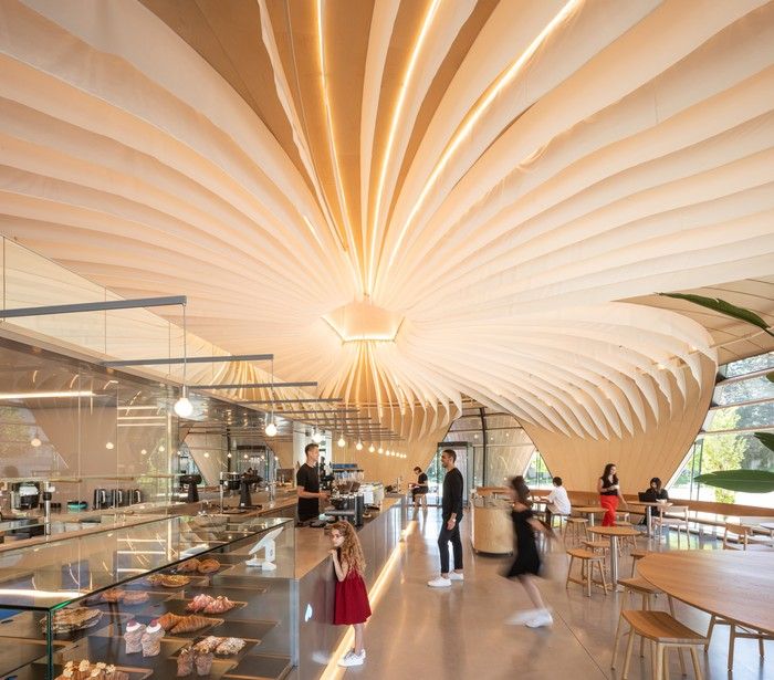 ThinkL worked with architectural firm Perkins & Will to create the lighting design for the Nemesis Coffee Shop at the Emily Carr University of Art & Design campus. The lighting glows through the internal ceiling fins and illuminates the space that was completed during the COVID 19 pandemic.