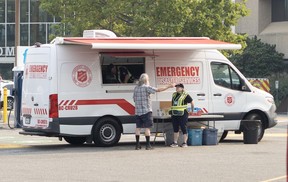 People affected by the Summerland fires wait at the Penticton Trade and Convention Centre on Aug. 10, 2026.