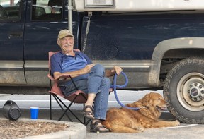 Tom Joseph with Molly, where people can get food, clothing and other help at Penticton Trade and Convention Centre on August 11, 2026.