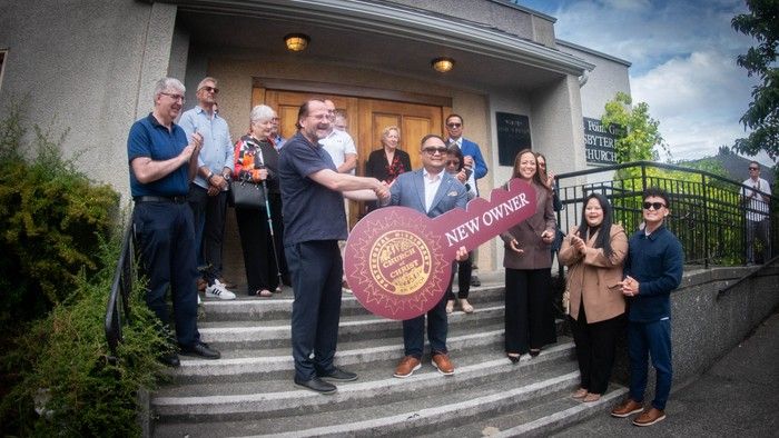  Rev. Richard Watson (left) shakes Pastor Joseph Concepcion’s’ hand outside West Point Grey Presbyterian Church on July 9. Photo: Marc Guido Bolen.