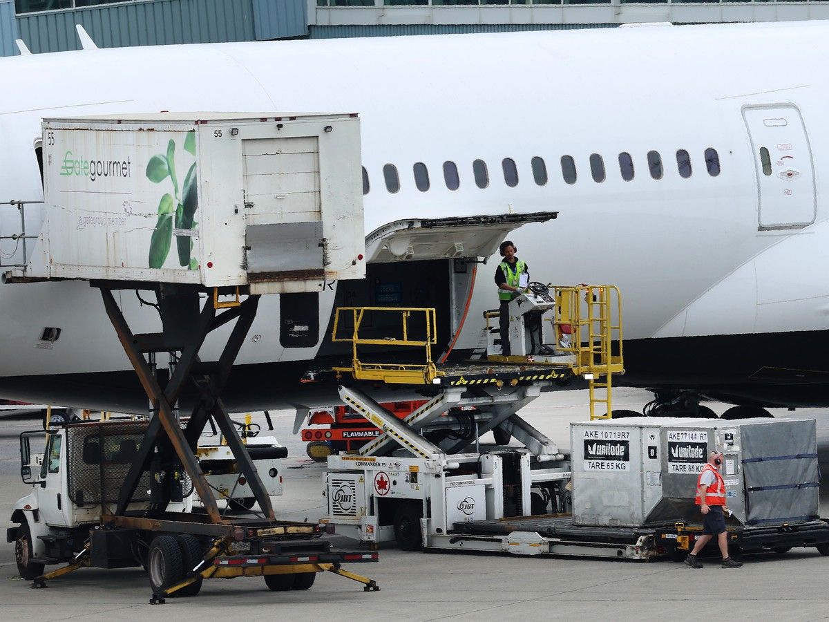 A plane is serviced at Vancouver International Airport in June.