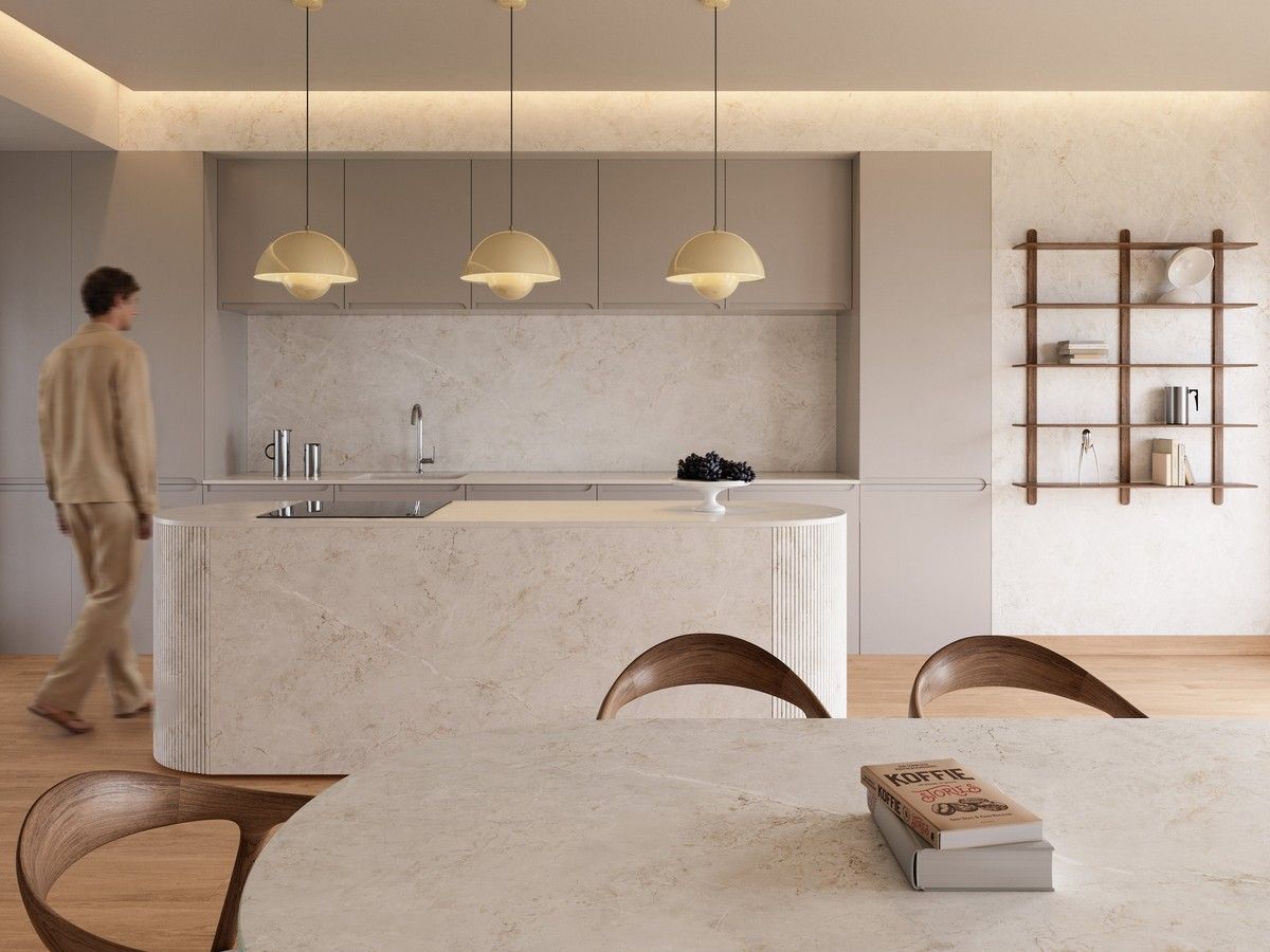 Pale stone surfaces wrap the kitchen island, backsplash and dining table in a calm, cohesive scheme, by Cosentino.