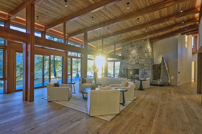 A split-granite, wood-burning fireplace anchors the living room and dining room