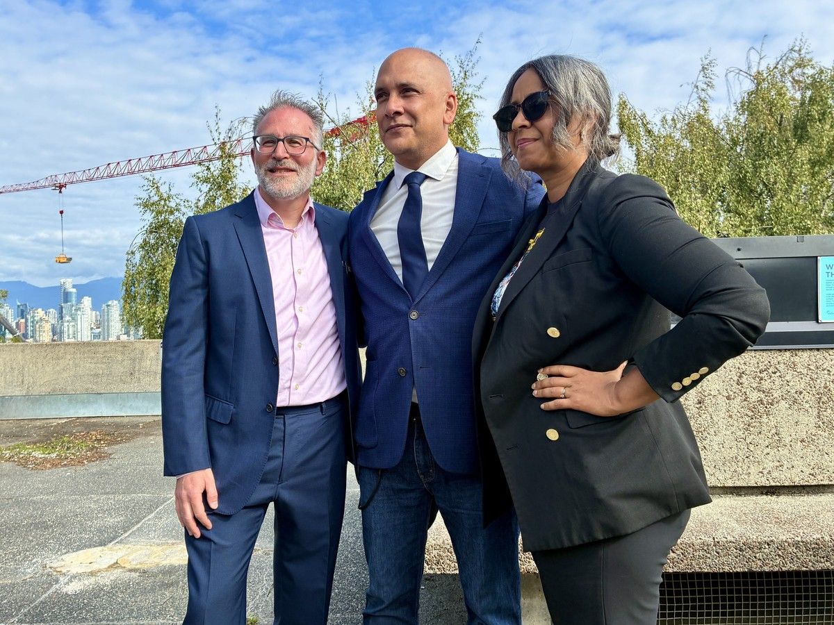 From left: Former OneCity mayoral candidate William Azaroff, left, Green mayoral candidate Pete Fry, and former COPE mayoral candidate Stephanie Allen, posing outside Vancouver city hall, moments after a press conference where Azaroff announced his withdrawal from the 2026 election campaign.