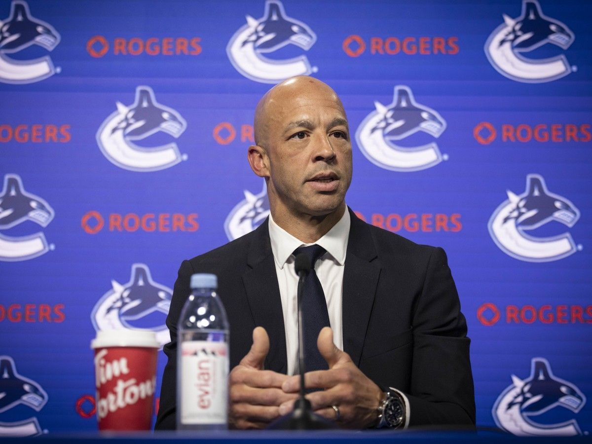 Manny Malhotra is introduced as the new coach of the Vancouver Canucks at Rogers Arena in Vancouver on June 4, 2026.