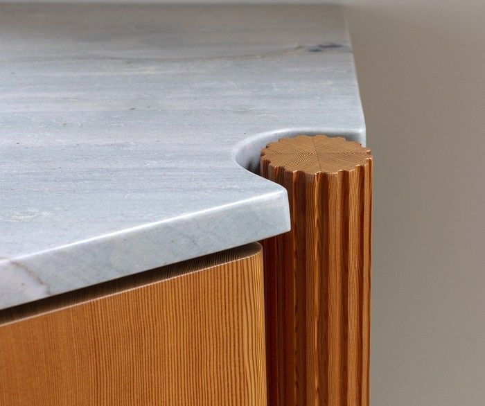 A custom fir vanity with fluted, tapered legs gives an upstairs ensuite a furniture-like quality.