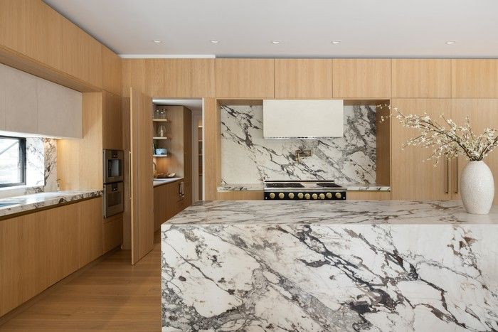 The kitchen is furnished by Italian manufacturer Scavolini and features Gaggenau stove and steam oven, Sub-Zero fridge, wine fridge and freezer, and a high-end Caliber nine-burner range.