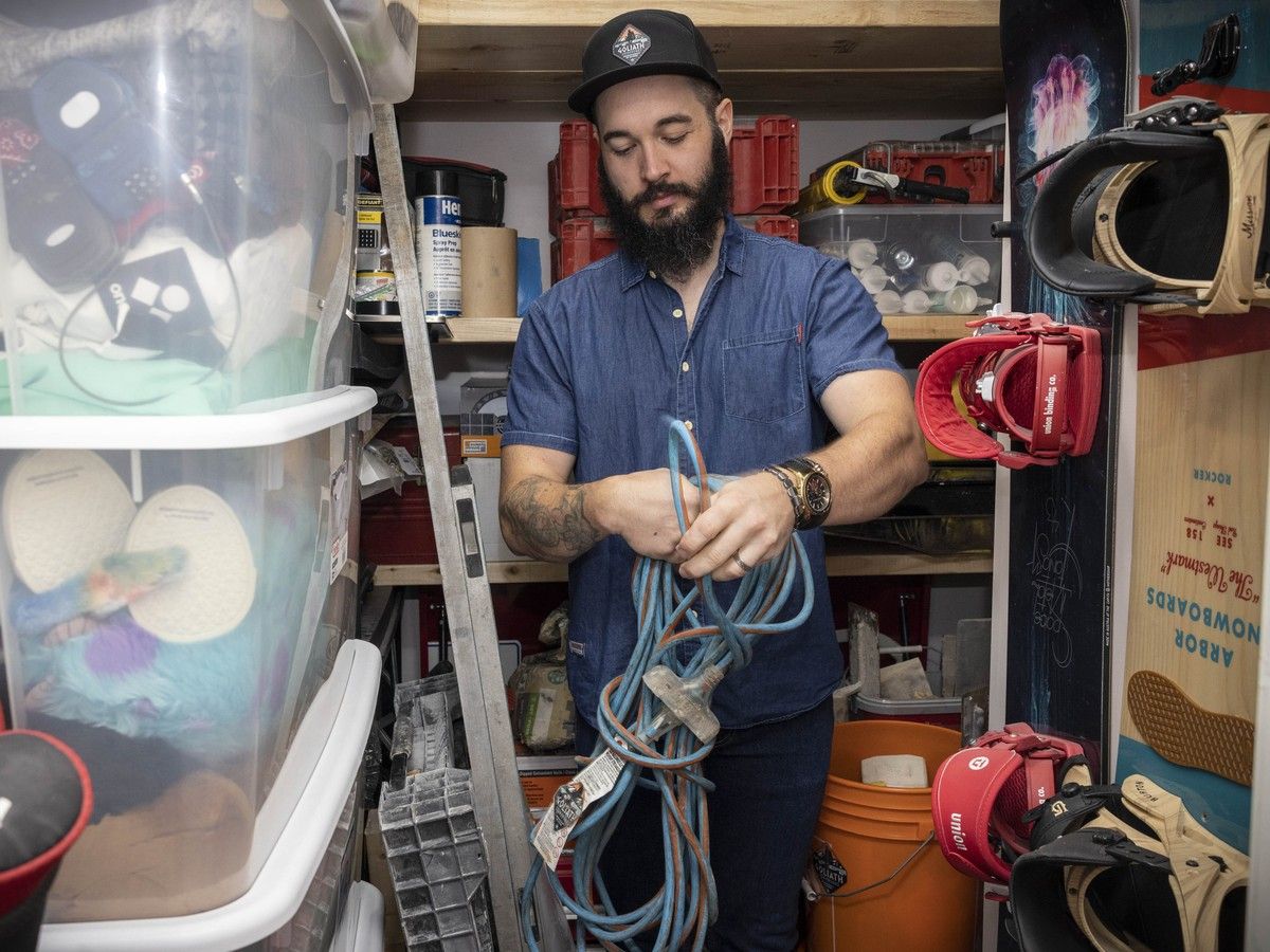  Zander Machan in his bedroom closet, where he has to store tools and sports equipment. He’d love to buy a larger home for his growing family, and says affordability is his No. 1 election issue.